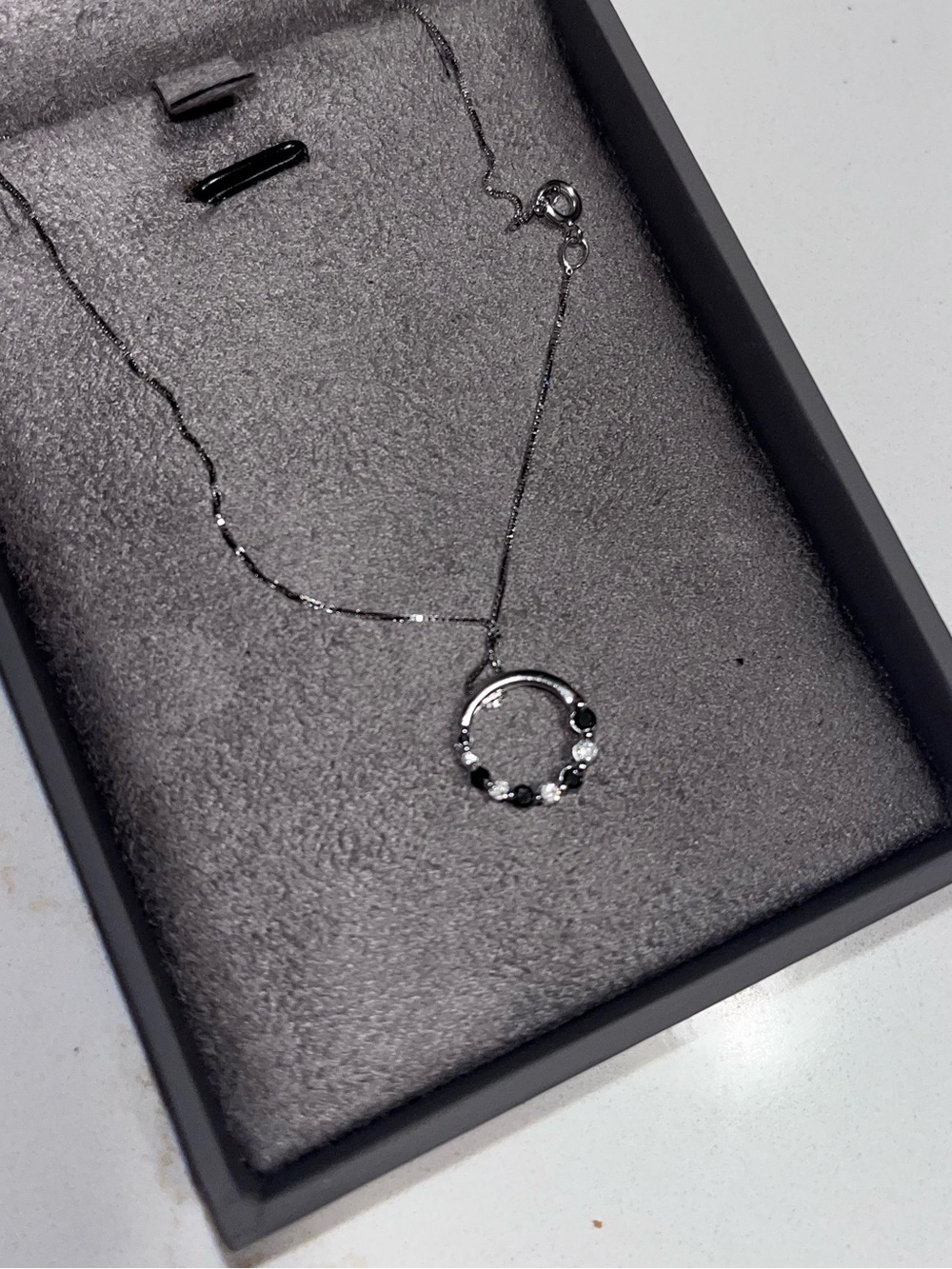Sterling Silver Circle Pendant Necklace with Black and White Stones